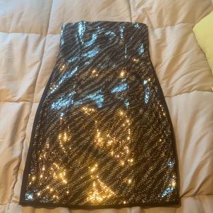 Gold sequin dress with black tiger striping.